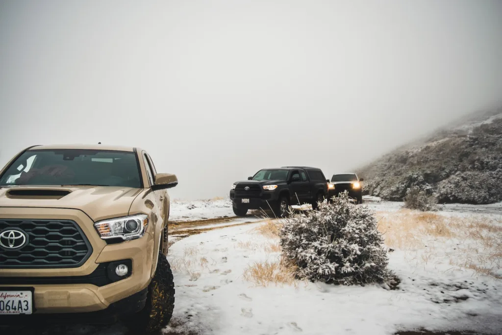 Winter Overlanding Toyota Tacoma's on a snow covered off-road trail