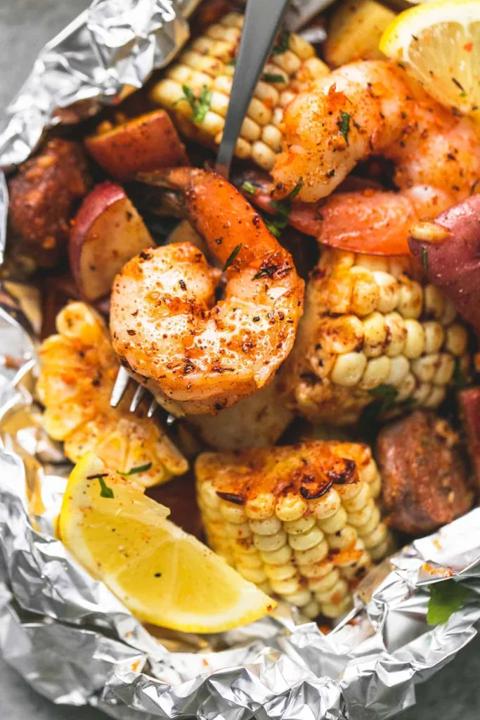 This picture shows the campfire recipe for shrimp boil foil packets